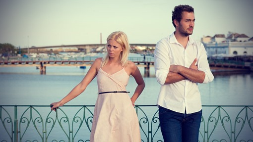 unhappy-couple-standing-on-the-bridge