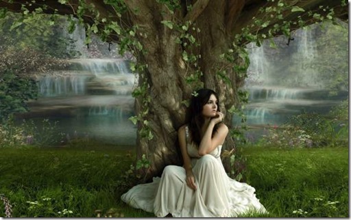 girl sitting under ancient tree