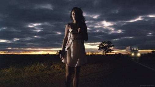 girl-in-light-dress-walking-on-the-road